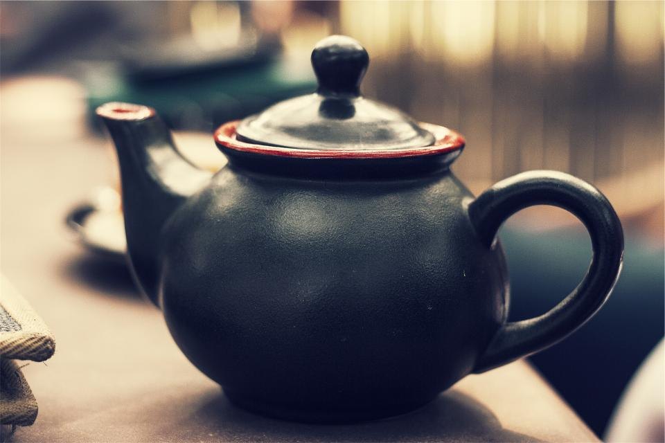 A ceramic teapot with its lid