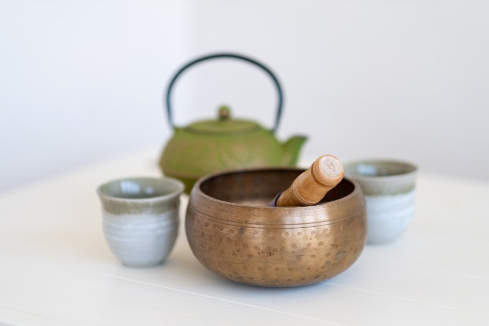 Cast-iron teapot with a small cup