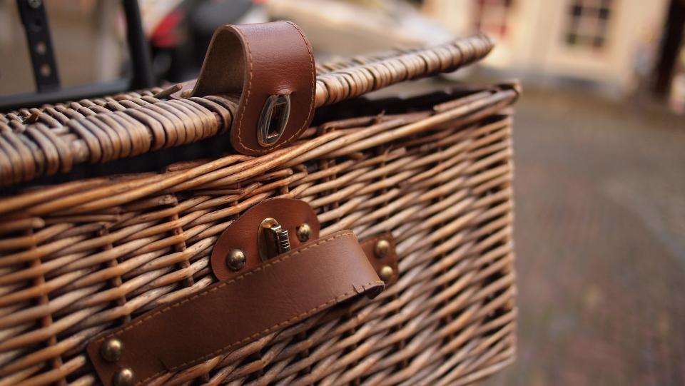 A rattan basket with woven sides