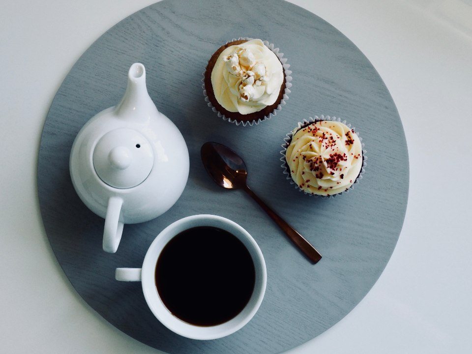 White teapot and cups arranged together